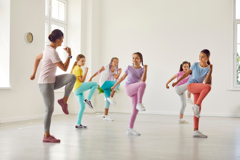 Instructor teaching young dancers at Inspire Dance Family